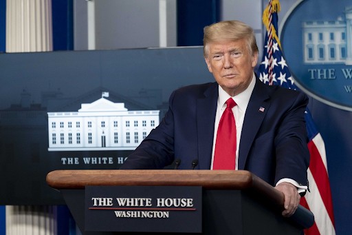 Evil-looking Trump standing in front of the White House
