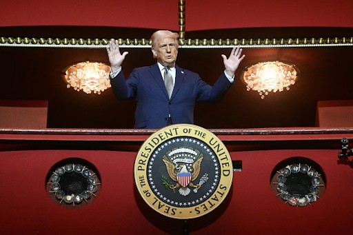 President Trump standing in the presidential box at the Kennedy Center